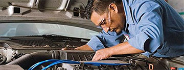 A mechanic working on a car