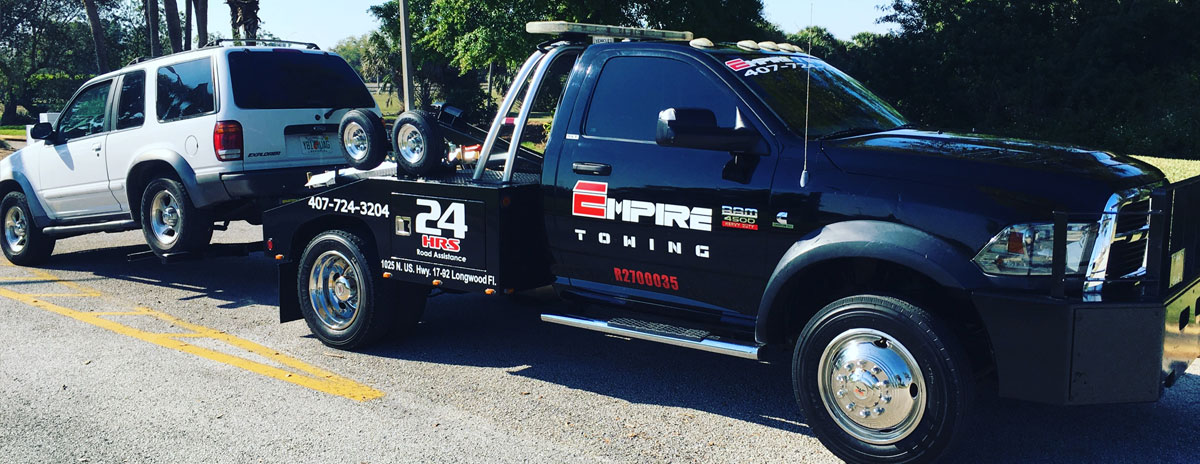 Orlando Towing Service Tow Truck Twoing a White SUV
